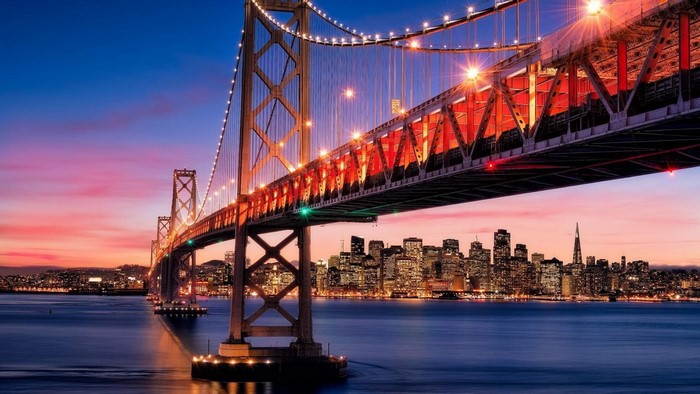 Bay Bridge at sunset with San Francisco skyline