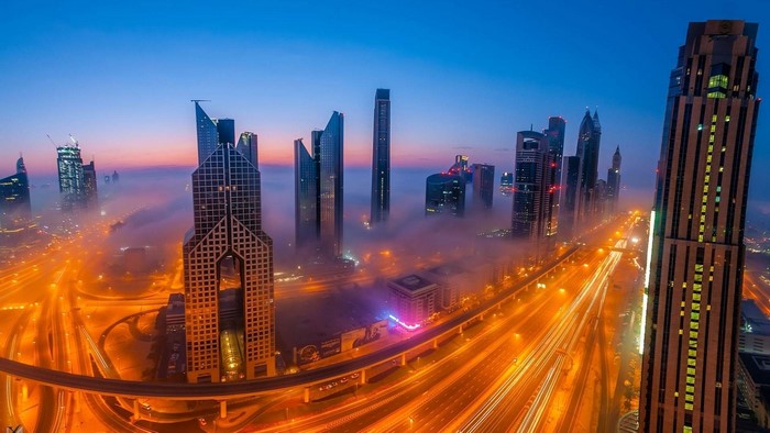 Dubai skyscrapers shrouded in fog at dawn