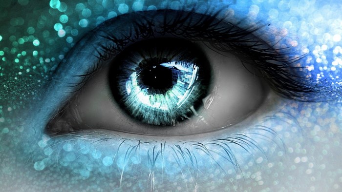 Close up of a fantasy blue eye with glitter