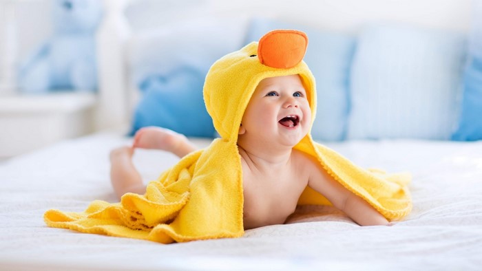 Baby in a yellow duck towel