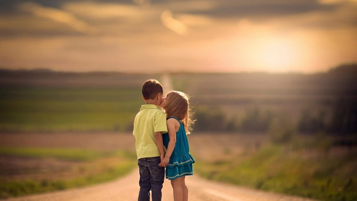 Children Sharing a Sweet Kiss at Sunset