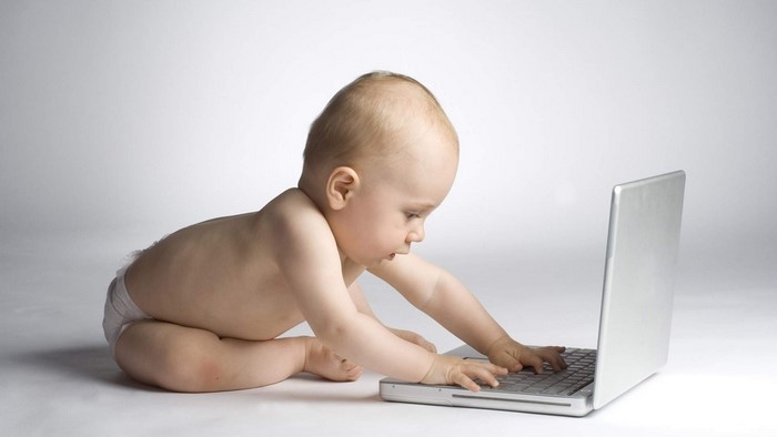 Baby boy using a laptop