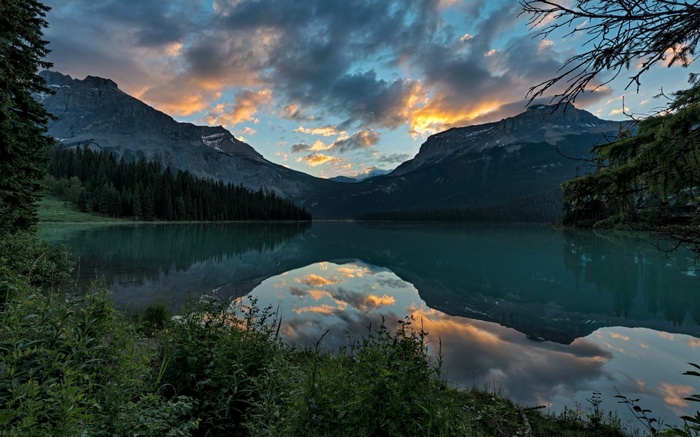 Mountain lake reflection at sunset