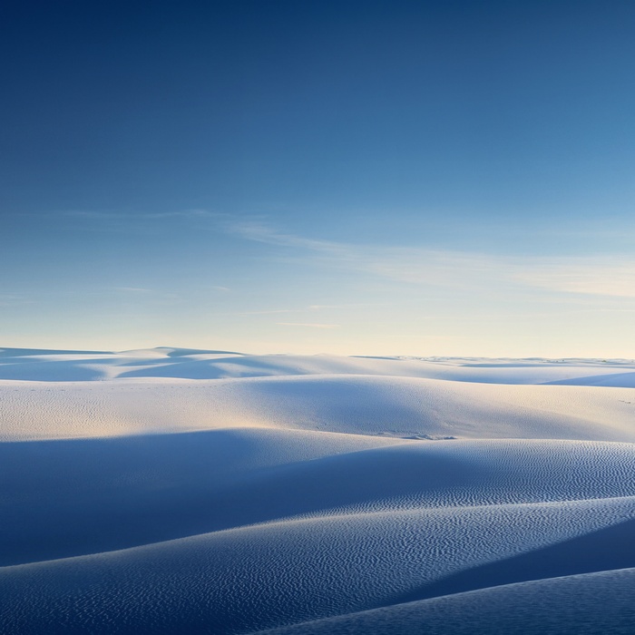 White Sand Dunes Under Blue Sky