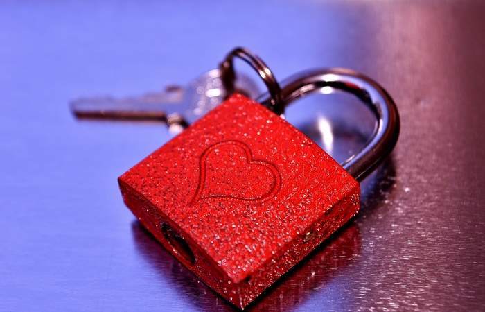 Red padlock with heart and key