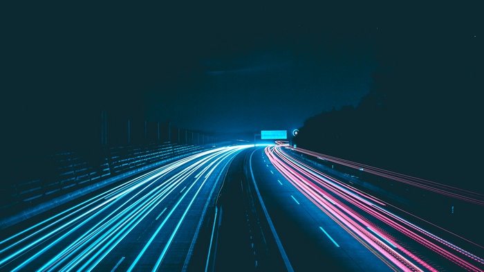 Night highway with light trails