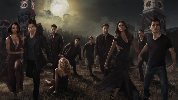 The Vampire Diaries cast in front of clock towers