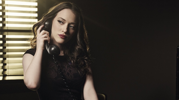 Kat Dennings on a vintage telephone