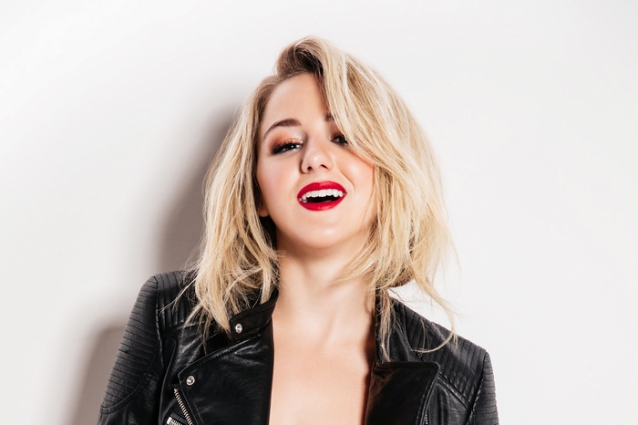 Chloe Lukasiak in a black leather jacket