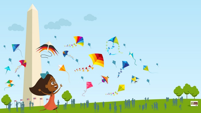 Girl flying kites at Washington Monument