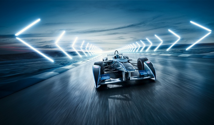 Formula E racing car on track with neon lights