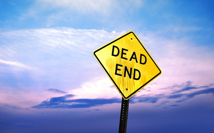 Yellow Dead End Sign Against Cloudy Sky