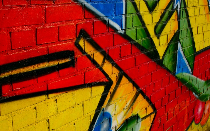 Graffiti art on a brick wall with bold colors
