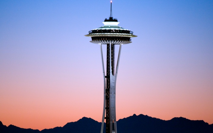 Space Needle at sunset with mountains