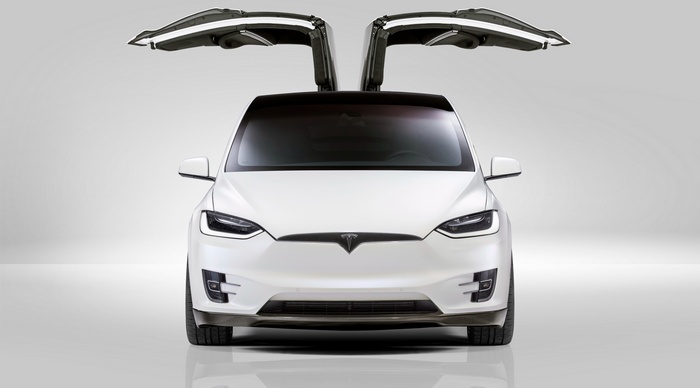 White Tesla Model X with Falcon Wing Doors Open