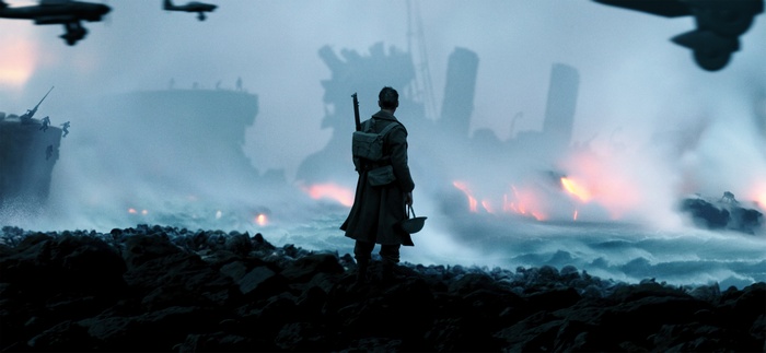 Soldier on a rocky shore during Dunkirk