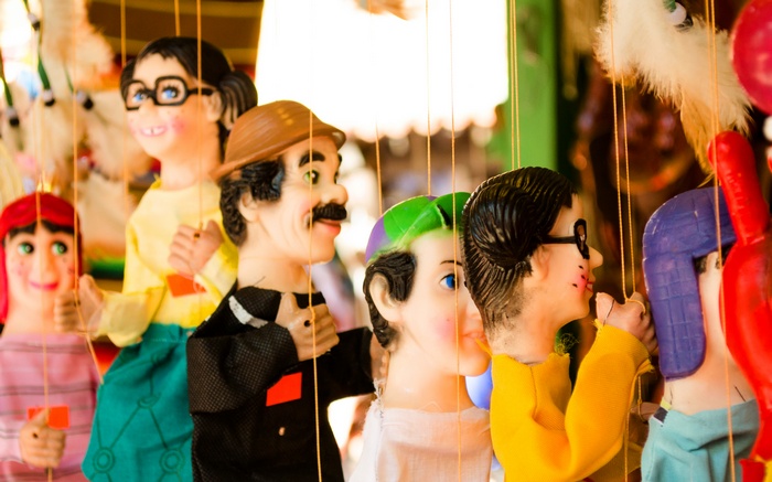 Puppets of famous characters hanging