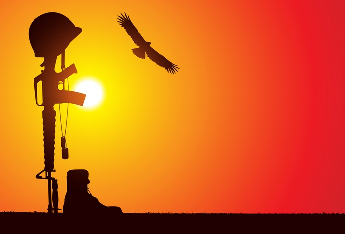 Soldier's fallen gear at sunset with eagle