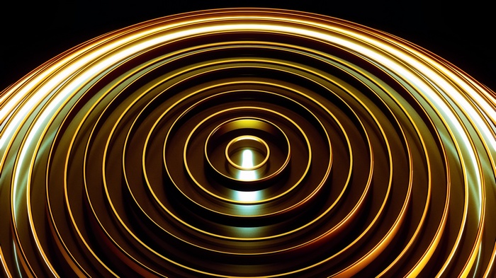 Abstract golden concentric circles with light reflections