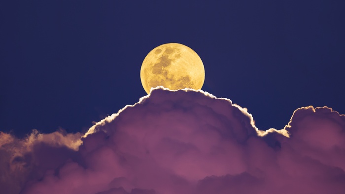 Full Moon Behind Purple Clouds