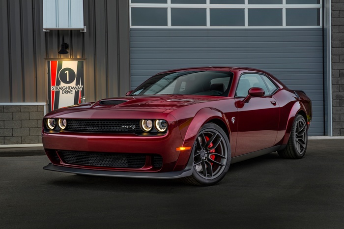 Red Dodge Challenger SRT Hellcat Widebody parked outside building