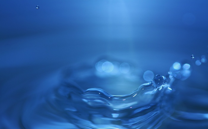 Blue water splash with droplets