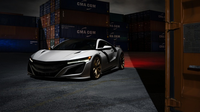 White Acura NSX with ADV1 wheels at a shipping yard