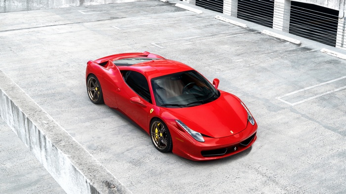 Red Ferrari 458 Italia in parking garage