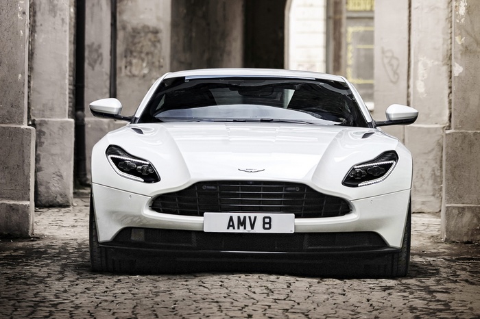 White Aston Martin DB11 V8 parked on cobblestone street