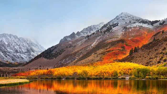 macOS High Sierra Landscape with Autumn Trees and Snow-Capped Mountains