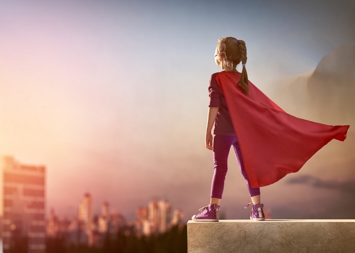 Girl in Supergirl Cosplay with Red Cape