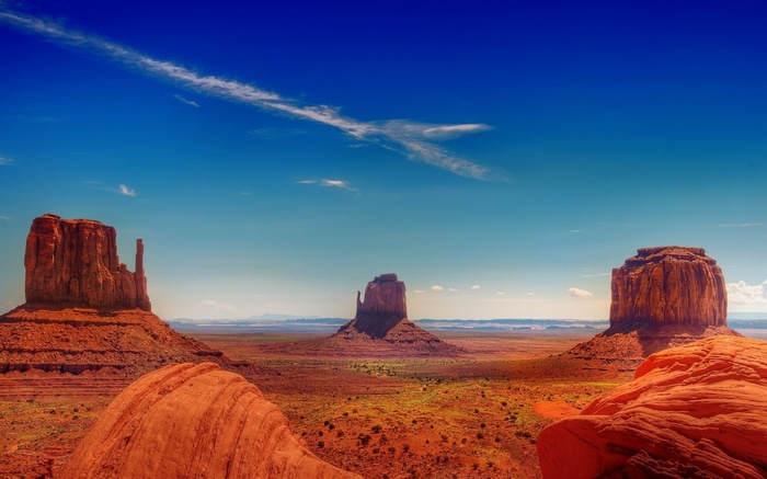 Monument Valley Mittens Buttes under blue sky
