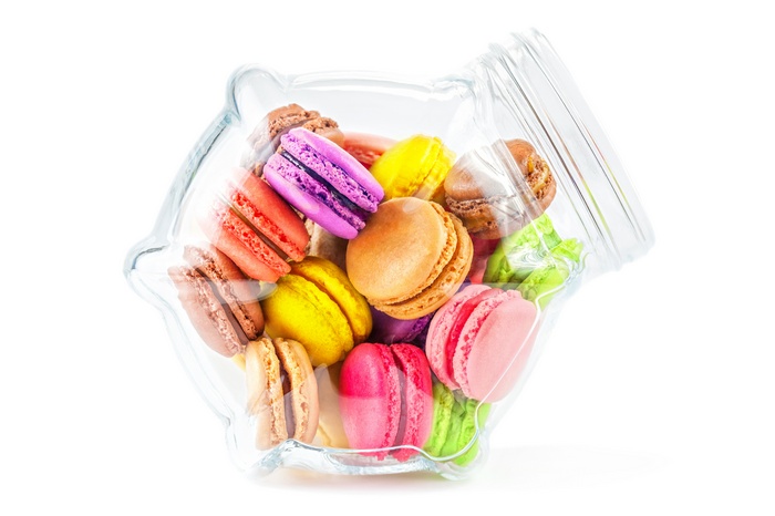 Colorful French Macarons in a Piggy Bank