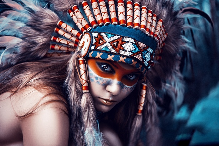 Woman in Native American Headdress with Face Paint