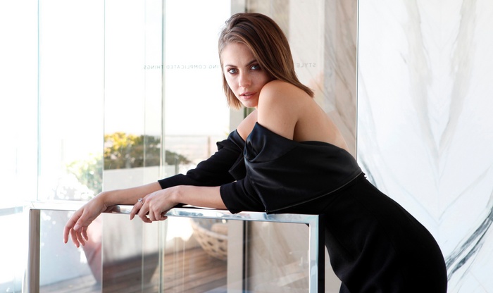 Willa Holland posing by a window