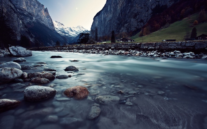 River flowing through a valley with mountains