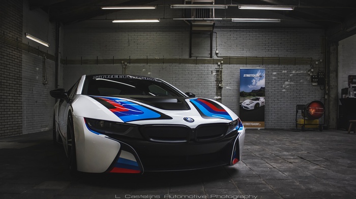 BMW i8 with M stripes in a garage