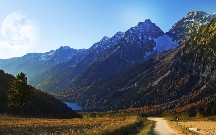 Mountain range with a lake and a dirt road