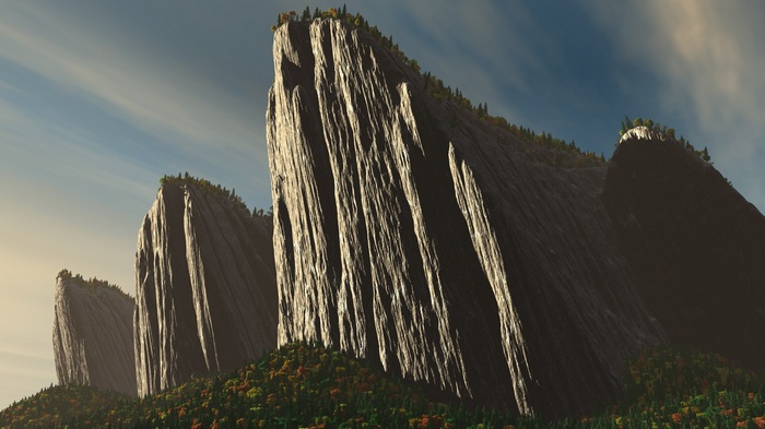 Jagged mountain peaks with trees and sky