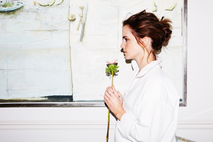 Emma Watson holding a flower