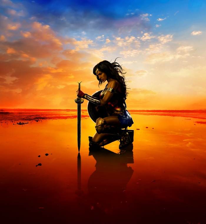 Wonder Woman kneeling with sword and shield