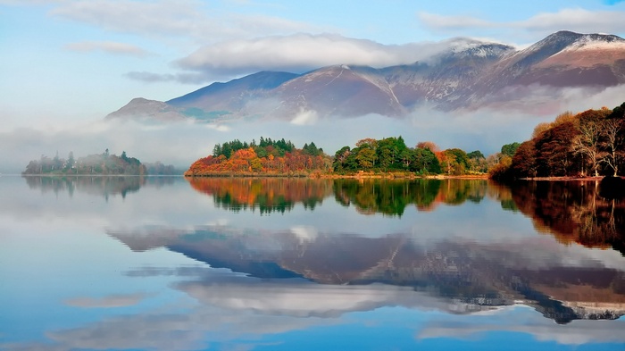 Lake with Islands and Mountains in Autumn Mist