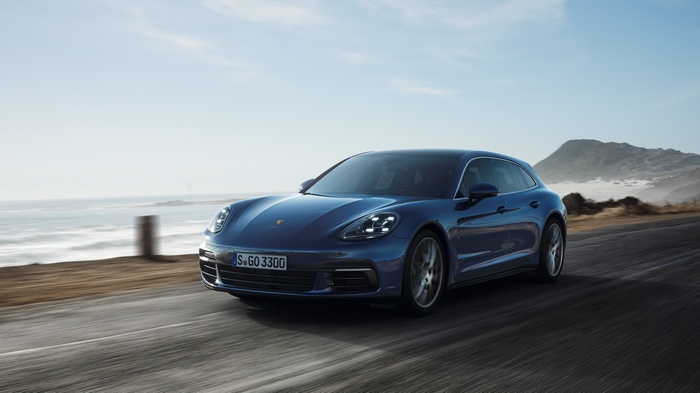 Blue Porsche Panamera 4S Diesel Sport Turismo driving on road