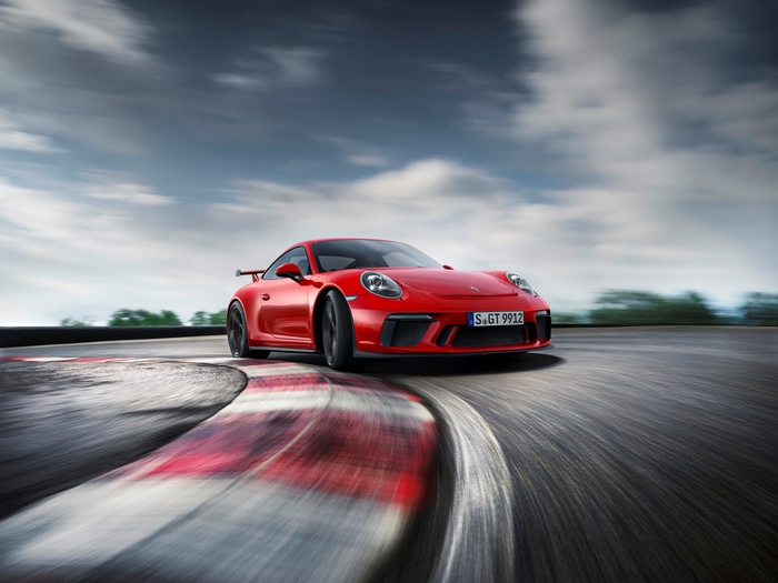 Red 2018 Porsche 911 GT3 on a Racetrack