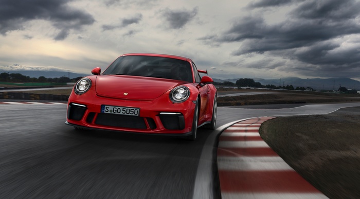 Red Porsche 911 GT3 on a Race Track