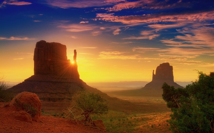 Monument Valley at sunset with sun rays