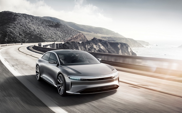 Lucid Air electric car on a coastal road
