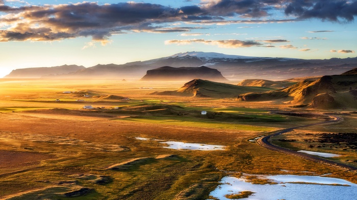 Golden hour landscape in Iceland with mountains and road
