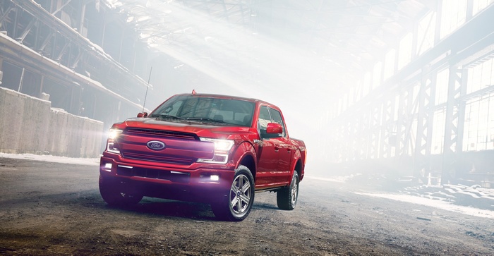 Red Ford F-150 Pickup Truck in Industrial Setting