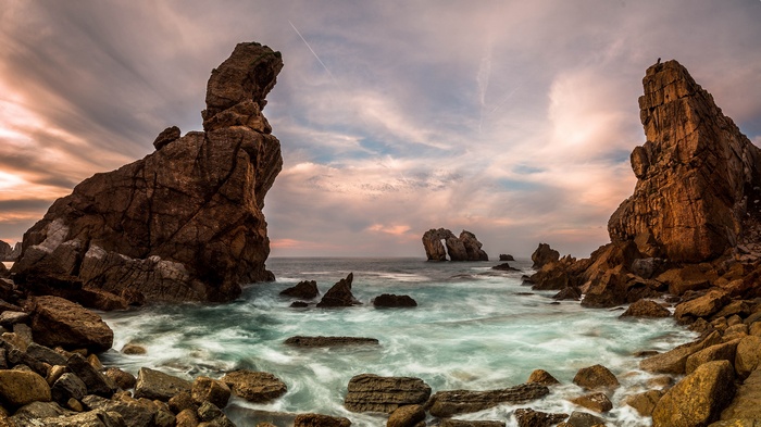 Rocky coastline with sea stacks at sunset